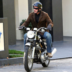 Reeves riding a motorcycle in CA. 