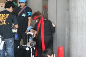 cosplayer with suitcase