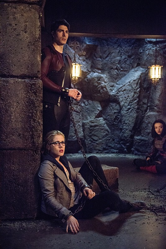 Team Arrow in chains in Ra's Al Ghul's dungeon