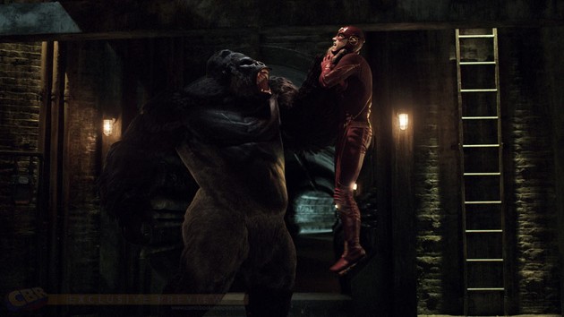 Grodd holding Flash by the throat.