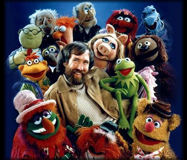 Jim Henson surrounded by Muppet characters