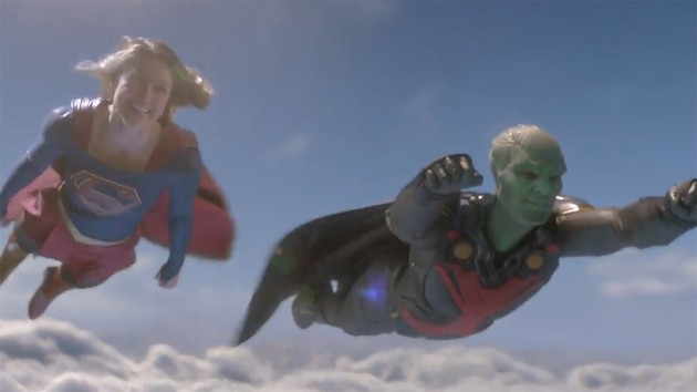 Supergirl flying with Martian Manhunter