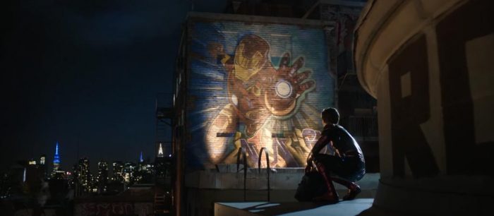 Spider-Man looking at a mural of Iron Man