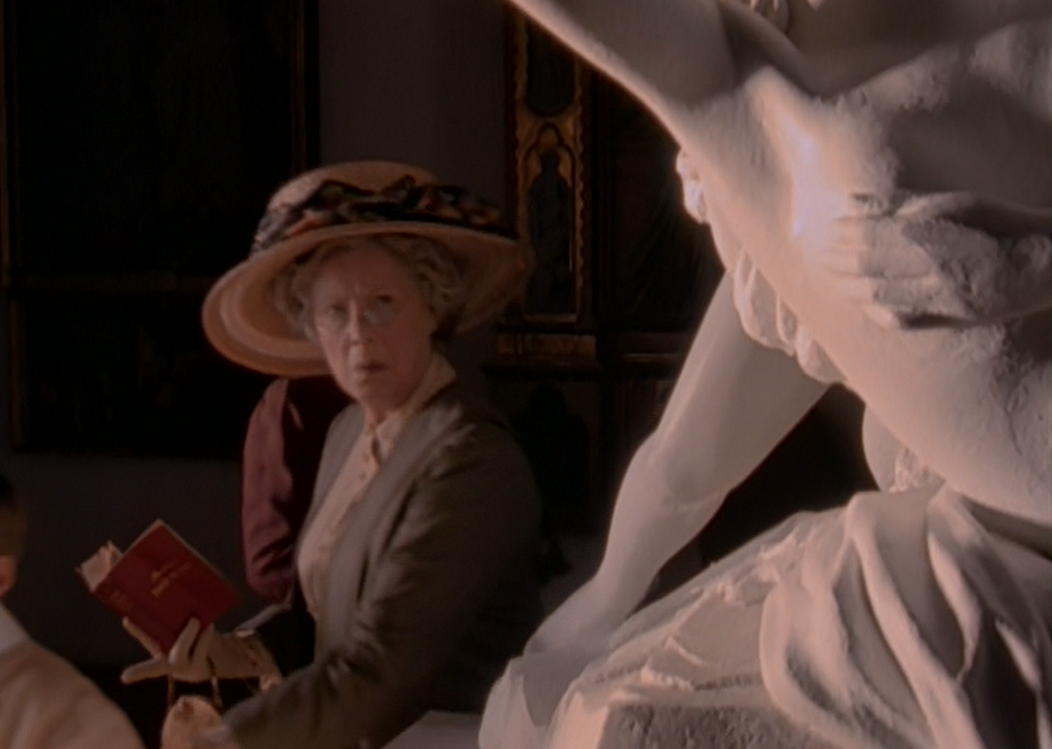 Miss Seymour looking disapprovingly at a statue